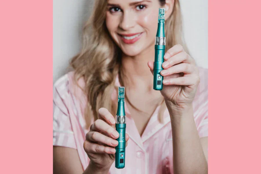 a woman holding two Dr. Pen A6S microneedling Pens