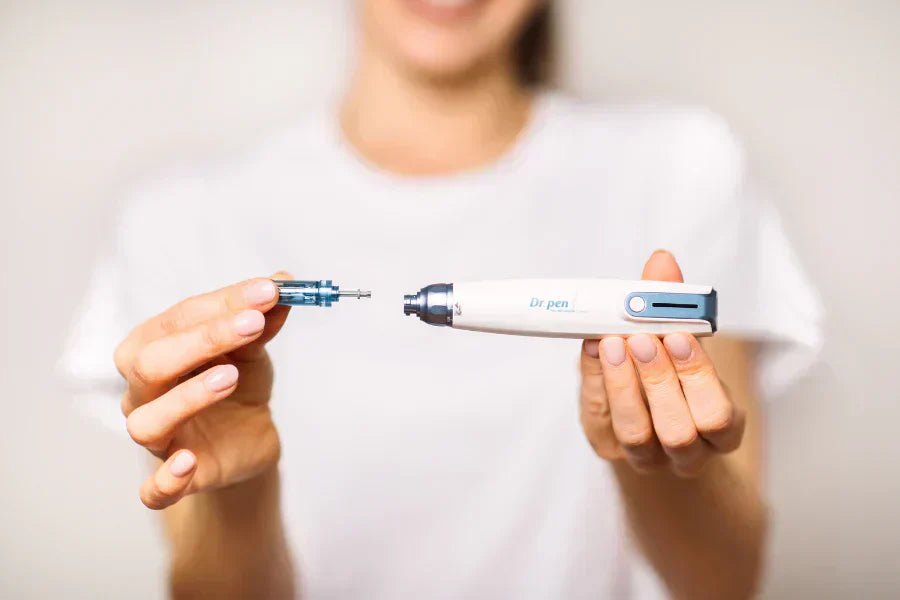 Women inserting a cartridge into Dr. Pen A9 Microneedling Pen