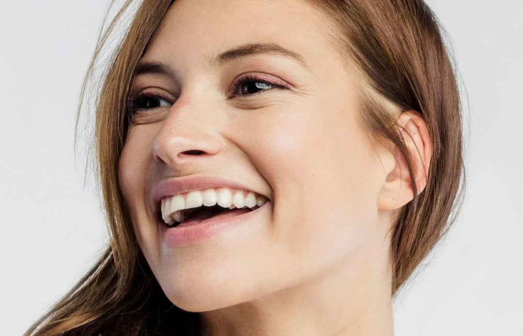 beautiful smile on a women who gained confidence after microneedling