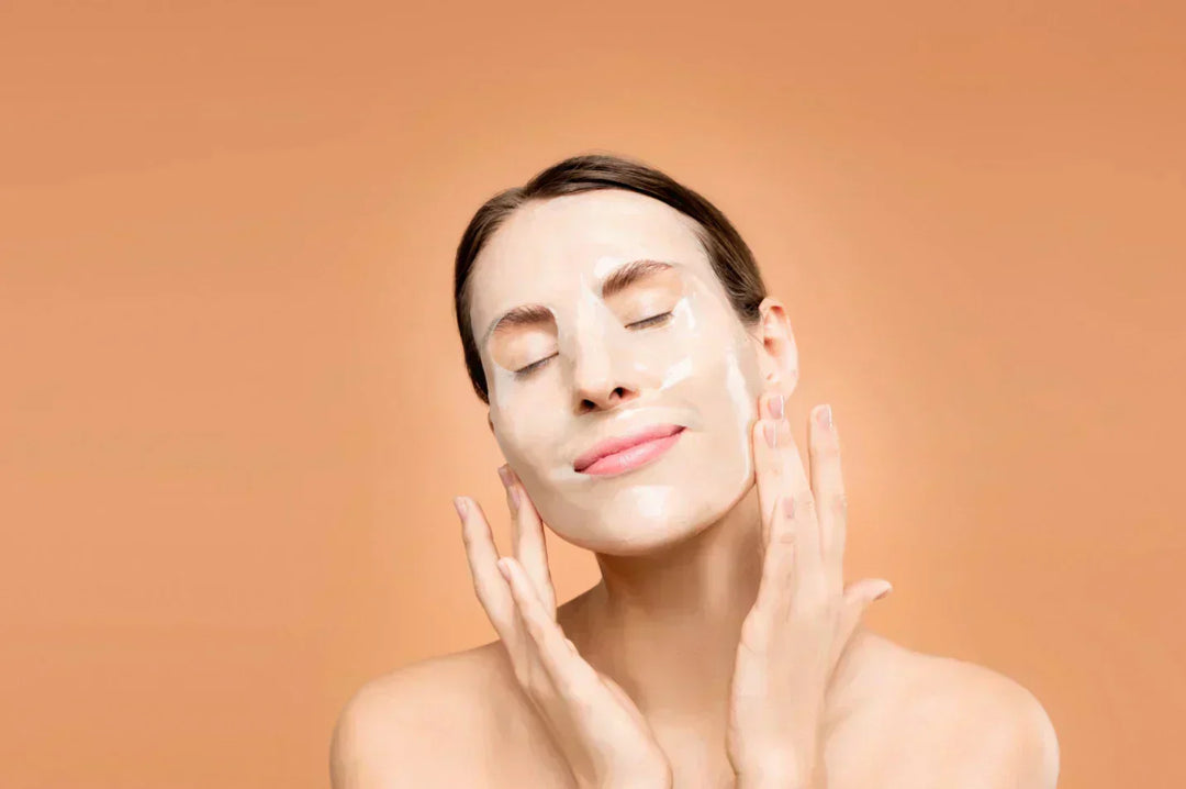 Closeup of woman using a sheet mask to moisturise her face