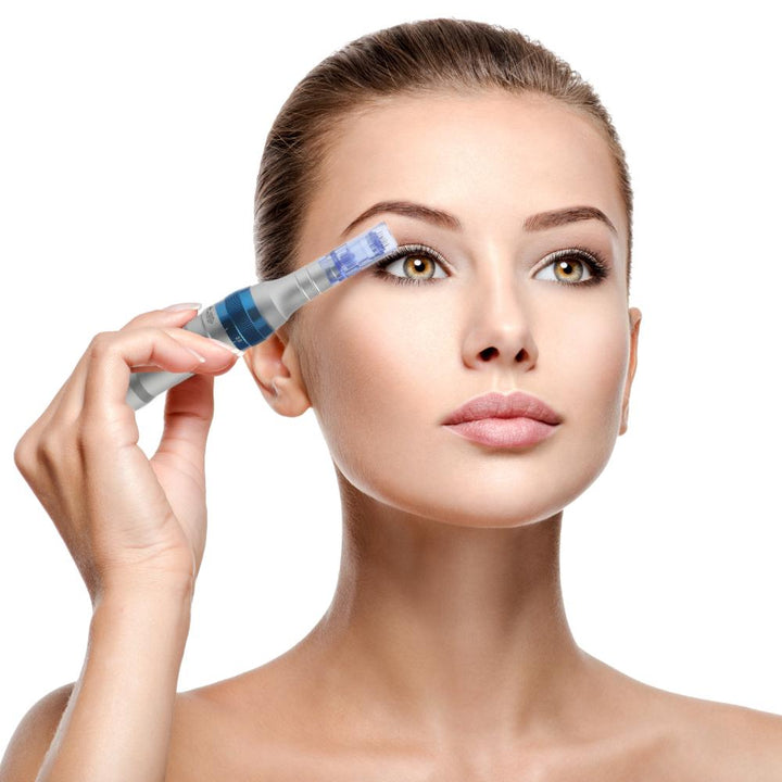 Image of model holding Dr. Pen Ultima A6 Professional Plus device