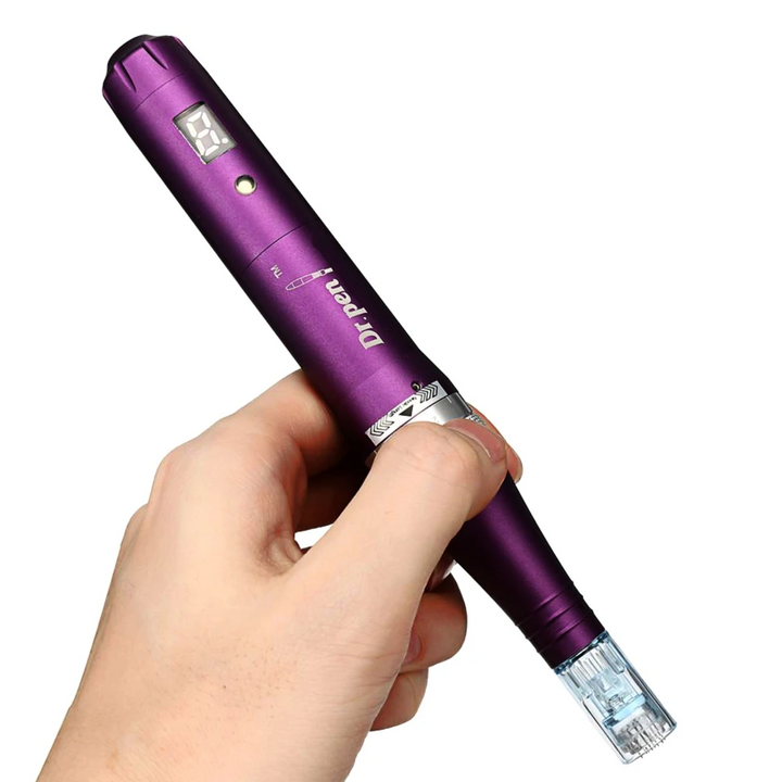 A hand holding  Dr. Pen Ultima X5 Derma Pen  