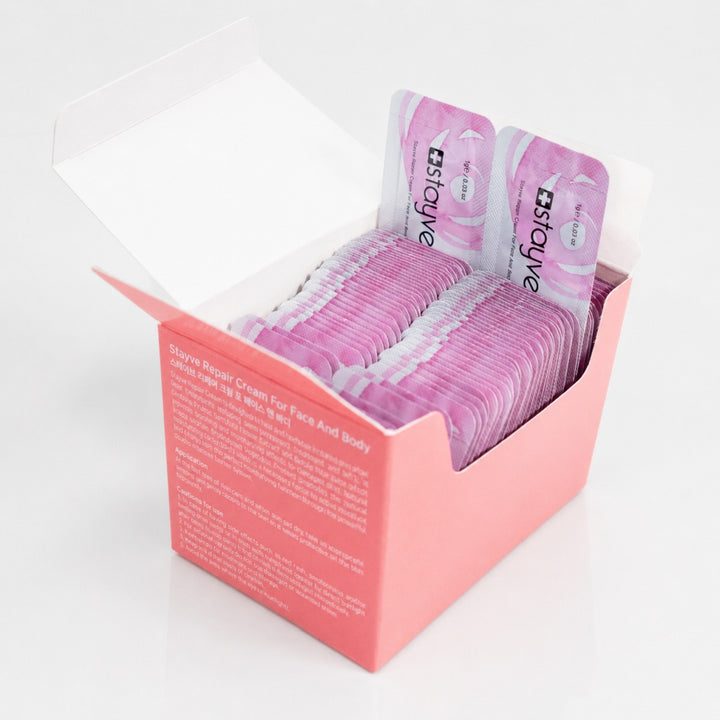 Open Stayve Repair Cream display box filled with pink single-use skincare sachets