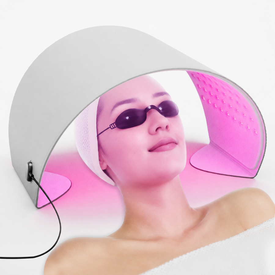 GooMi FlexiGlow Red Light Therapy Panel in use over the face during an at-home session, with eye protection goggles