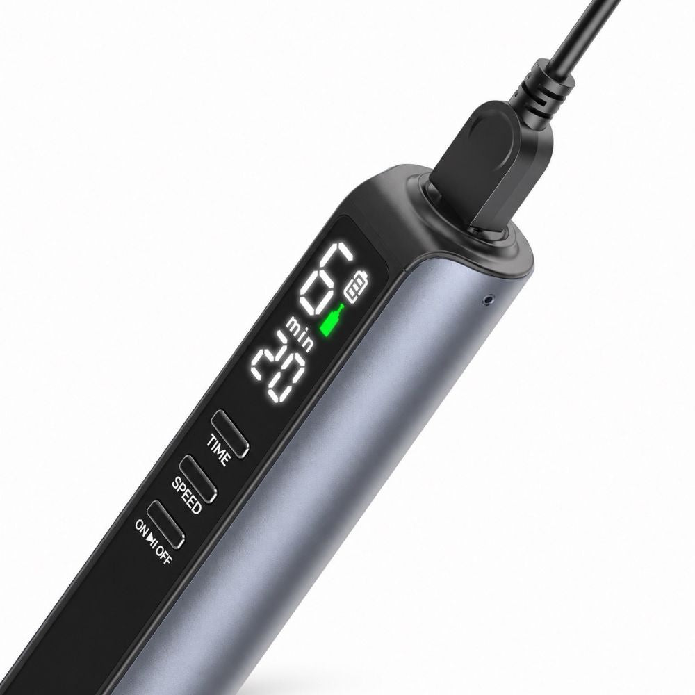 Close up to tip of Dr. Pen M8 Max Microneedling Pen connected to charging cable
