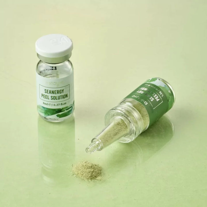 Stayve Seanergy Peel Powder vial with applicator tip and spilled exfoliating powder beside solution bottle
